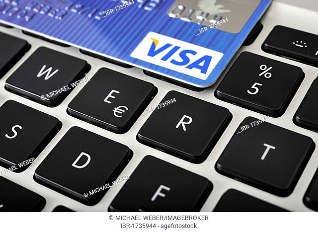 The letters WERT, German for value, with a VISA credit card on the keyboard of a laptop, PC, symbolic image for Internet businesses and computer businesses