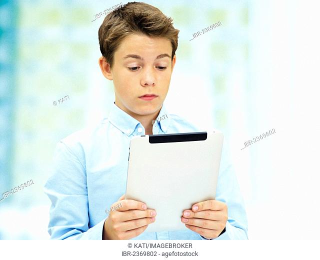 Portrait, schoolboy, teenager with an iPad