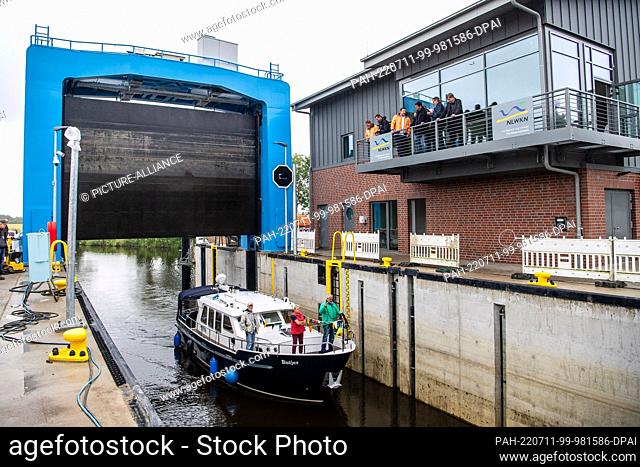 11 July 2022, Lower Saxony, Otterndorf: A boat is moored in the Hadelner Canal Lock. Currently the largest coastal protection project in Lower Saxony