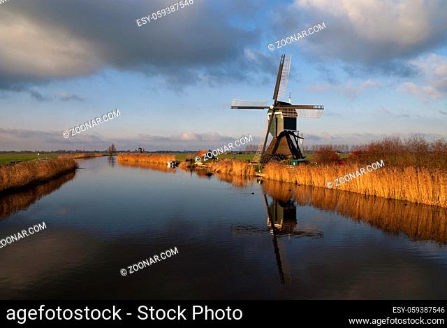 The Achterlandse windmill along the canal called Ammersche Boezem near Groot-Ammers in the Dutch region Alblasserwaard