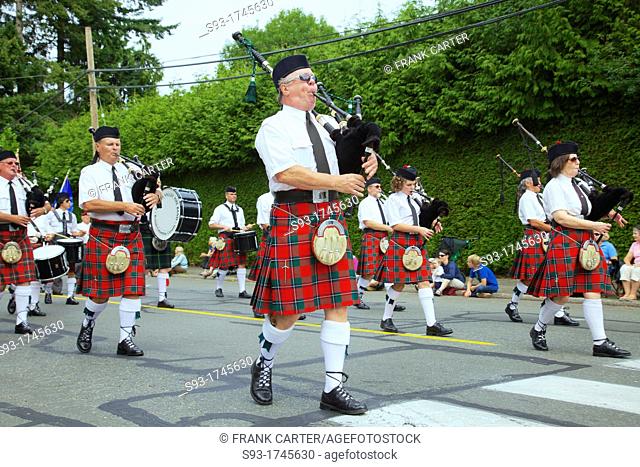 A Scotish Highland bagpipe band on parade during the Comox Aquatic Days festival