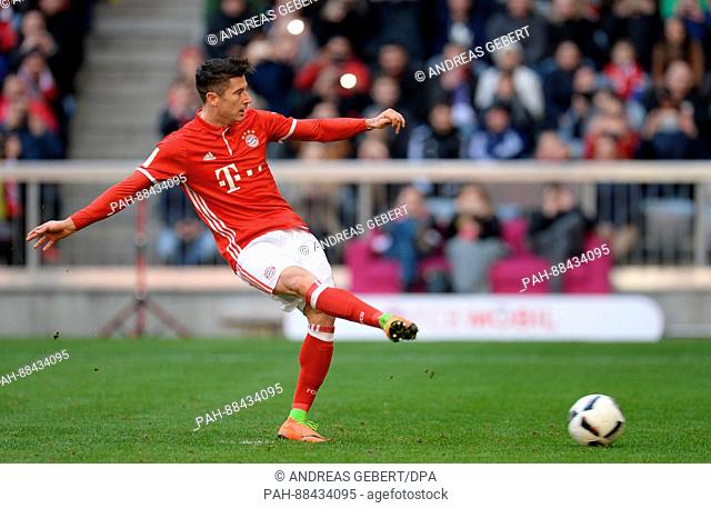 Robert Lewandowski from Munich scores the 2-0 goal during the German Bundesliga soccer match between Bayern Munich and Hamburger SV in the Allianz Arena in...