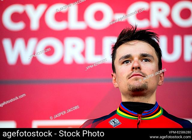 British Thomas Tom Pidcock celebrates on the podium after winning the men's elite race at the World Cup cyclocross cycling event in Namur, Belgium