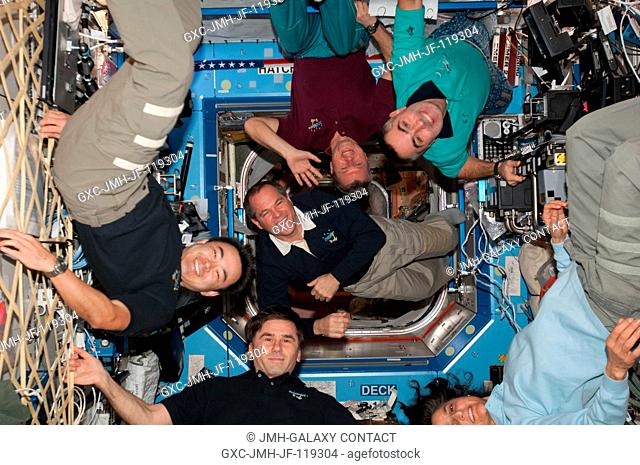 Expedition 3233 and Expedition 3334 crew members are pictured in the International Space Station's Destiny laboratory following the ceremony of...