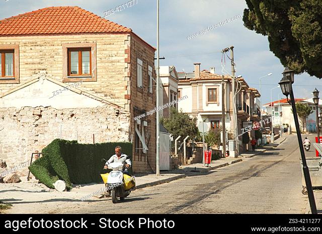 Motorcyclist in front of the traditional buildings at the town center of Cunda or so-called Alibey Island-Alibey Adasi, Ayvalik, Ayvalik Islands Balikesir City