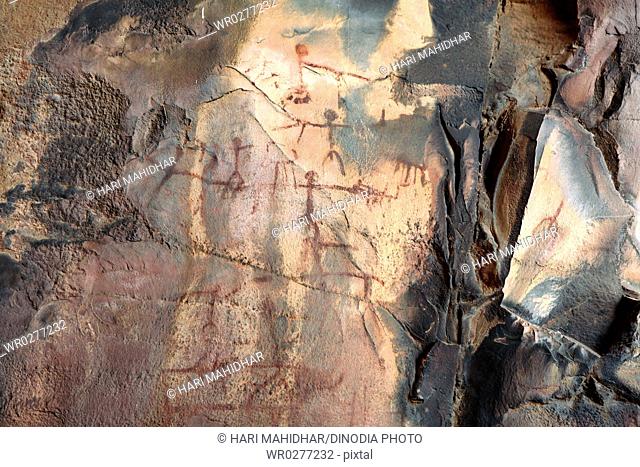 Cave paintings showing men on rock shelters no 3 ten thousands years old at Bhimbetka near Bhopal , Madhya Pradesh , India