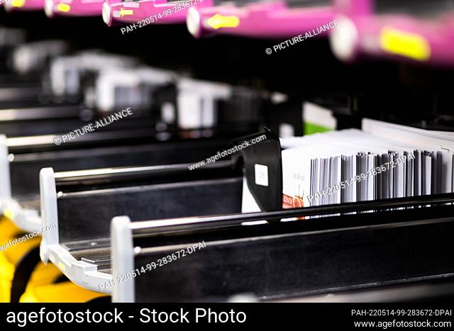 13 May 2022, Baden-Wuerttemberg, Offenburg: Letters stand in a sorting machine at Deutsche Post's mail center in Offenburg