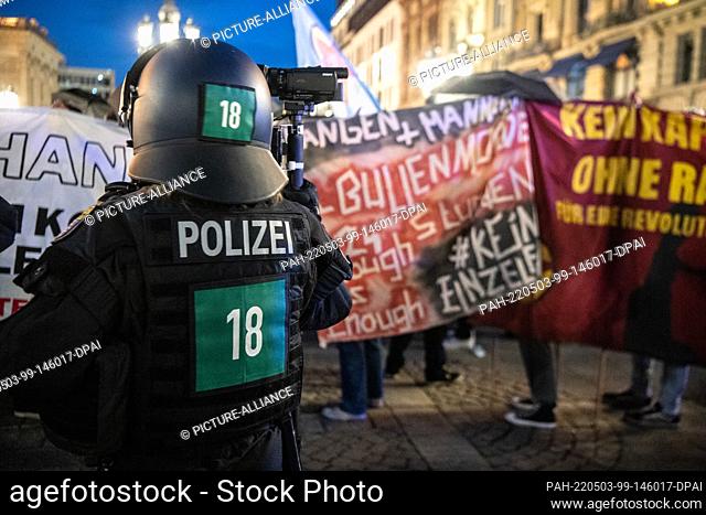 03 May 2022, Hessen, Frankfurt/Main: Several hundred people from the left-wing spectrum protest against police violence and racism during a march through the...