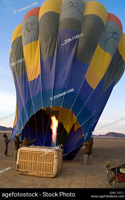 Blowing up a hoair balloon in the namib desert