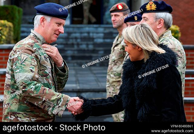 King Philippe - Filip of Belgium and Defence minister Ludivine Dedonder shake hands before a royal visit to the King Albert military camp in Marche-en-Famenne