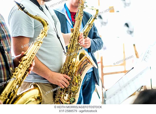 Jazz music : a musican playing a saxophone in a group