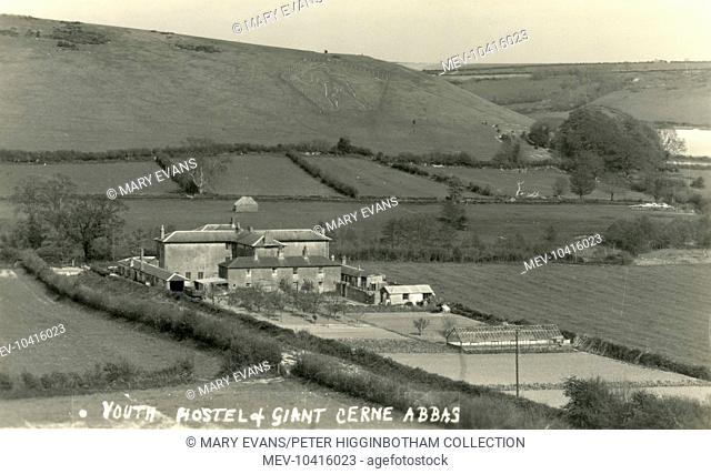 Distant view of the youth hostel at Cerne Abbas, Dorset. At the rear is the Cerne Abbas Giant carved into the hillside in chalk
