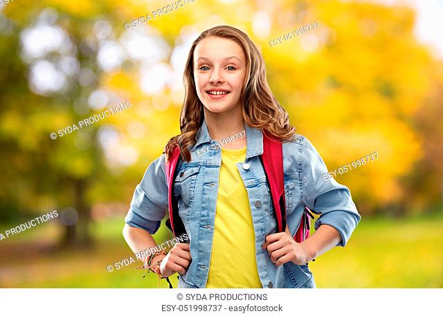 happy smiling teenage student girl with school bag
