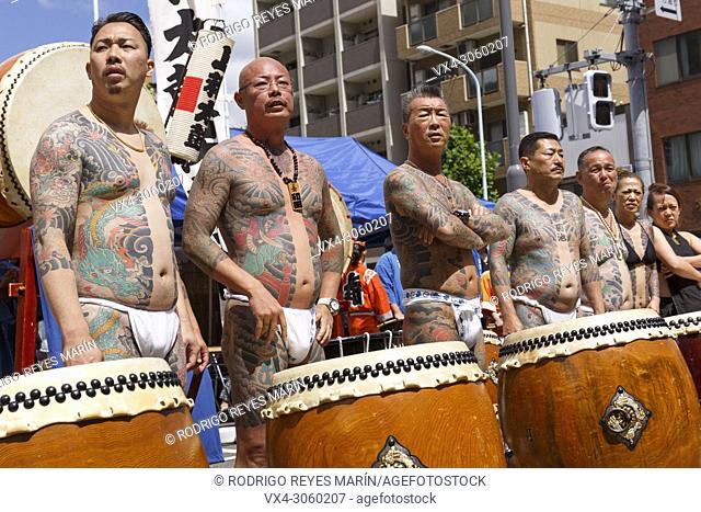 Participants showing their full body tattooed, possibly members of the Japanese mafia or Yakuza, attend the Sanja Matsuri in Asakusa district on May 20, 2018