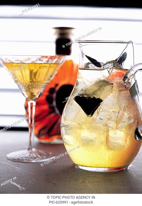Cognac Bottle, a Cocktail and a liquor glass