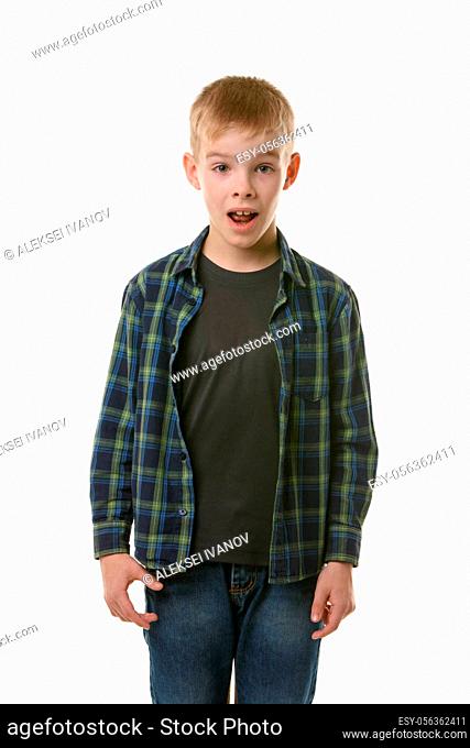 Astonished ten year old boy with open mouth on white background