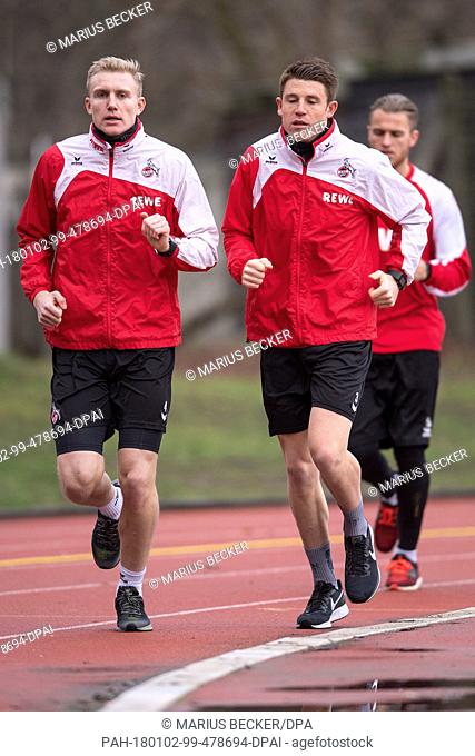 Frederik Sörensen (L) and Dominique Heintz running for the fitness test during the begin of the training of 1. FC Cologne in Cologne, Germany, 02 January 2018