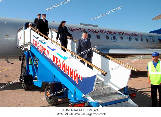 The Expedition 24 crew members deplane upon their arrival at the Baikonur Cosmodrome on June 3, 2010, to prepare for their June 15 launch to the International...