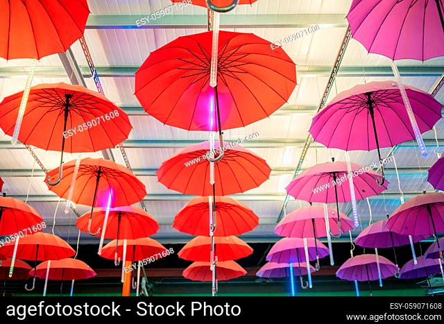 Multiple colorful umbrellas hanging from the roof at Ping Tung night market, Taiwan