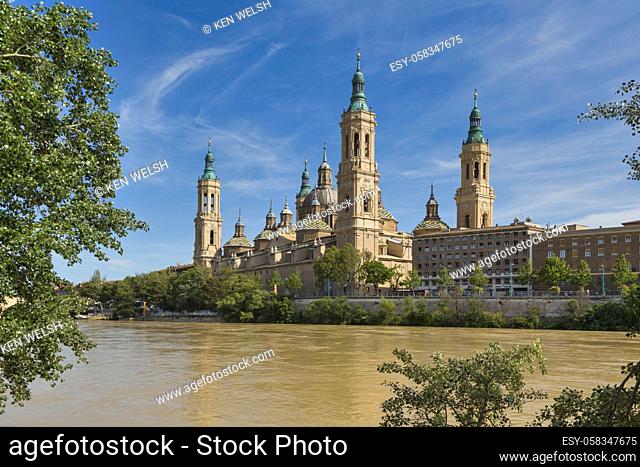 Zaragoza, Zaragoza Province, Aragon, Spain. The Baroque style Basilica de Nuestra Señora del Pilar, or Our Lady of the Pillar, seen across the Ebro River