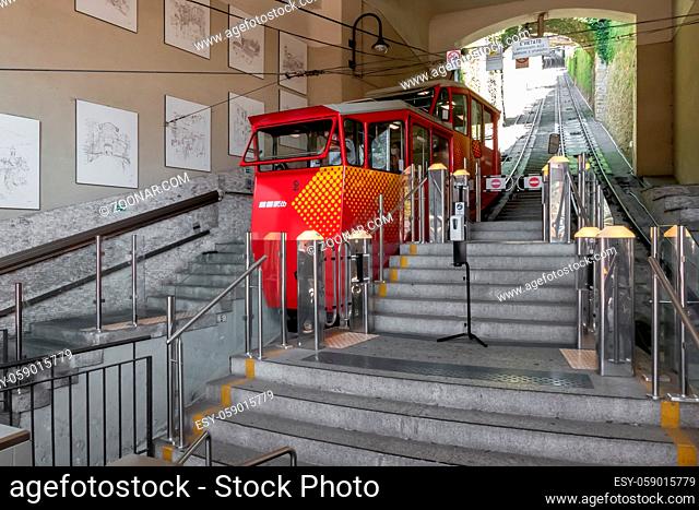 Upper city funicular line in Bergamo (Funicolare Citta Alta). Red funicular connects old Upper City and new. Bergamo (upper town), ITALY - August 19, 2020