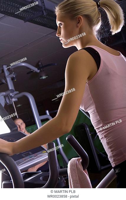 young woman training on Stairmaster