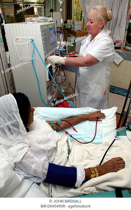 Support Nurse attending to renal outpatient on Dialysis
