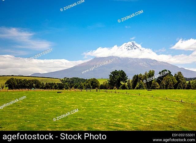 An image of the volcano Taranaki covered in clouds, New Zealand