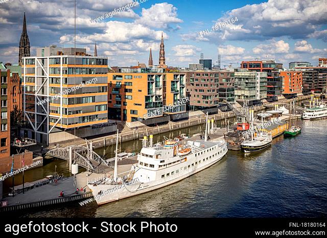 View of the museum harbor at Sandtorkai in the light of the autumn sun with the old seafaring ship Seute Deern (today an event location) and the interesting...
