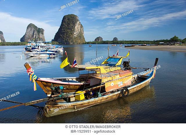 Karst rock formations and fishing boats in the Bay of Pakmeng, Trang, Thailand, Southeast Asia, Asia