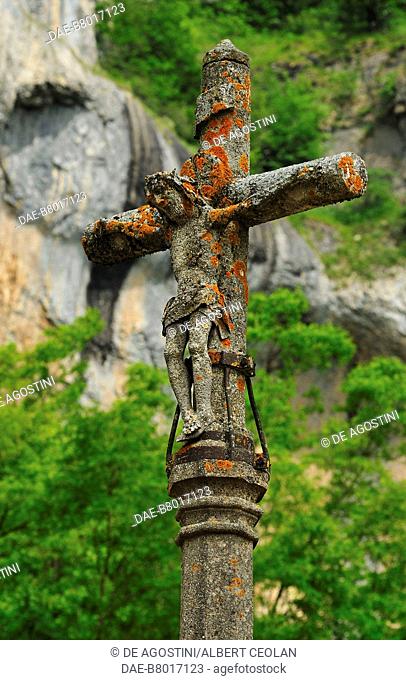 A stone crucifix near Saint John the Baptist Church, Baume-les-Messieurs, Burgundy-Franche-Comte, France