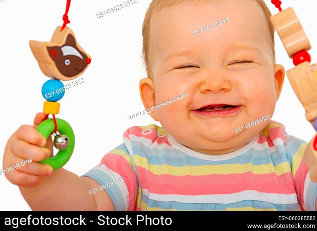 Baby laughs while playing