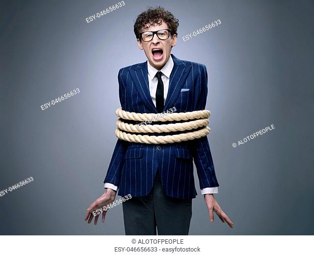 Business man tied up with rope