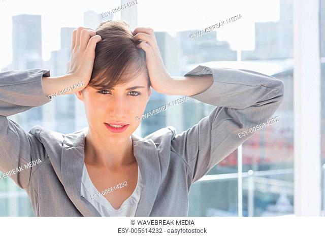 Frustrated businesswoman looking at camera