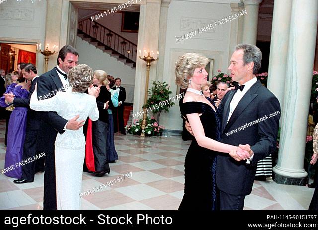 In this photo provided by the Ronald Reagan Presidential Library, Tom Selleck dances with Nancy Reagan, left, and Princess Diana and Clint Eastwood dance, right