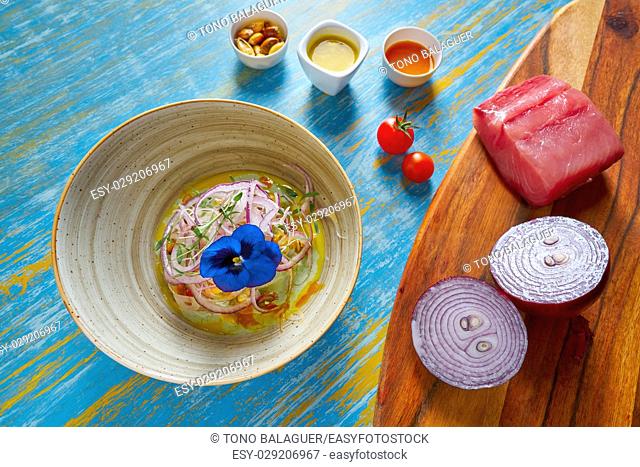Fish ceviche latin preuvian recipe on bowl with pansy flower