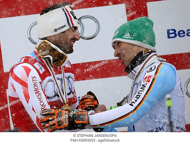 Felix Neureuter (R) congratulates Jean-Baptiste Grange of France (gold) after the mens slalom at the Alpine Skiing World Championships in Vail - Beaver Creek