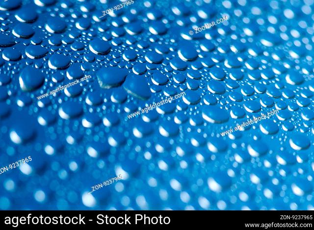 close-up of water drops on the blue background