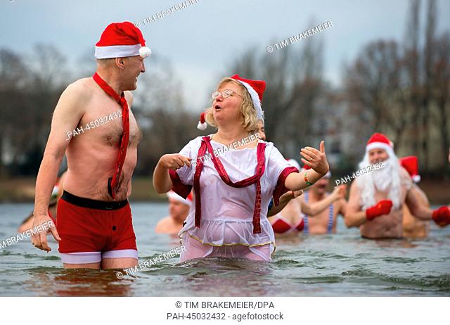 Members of the ""Berlin Seals"" swim in Lake Orankesee in Berlin, Germany, 25 December 2013. Swimming on Christmas day is a tradition with winter swimmers