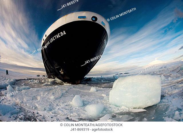 Marina Svetaeva, Ice-strengthened Russian cruise ship ( Aurora Expeditions) in McMurdo Sound - volcano Mt Erebus behind