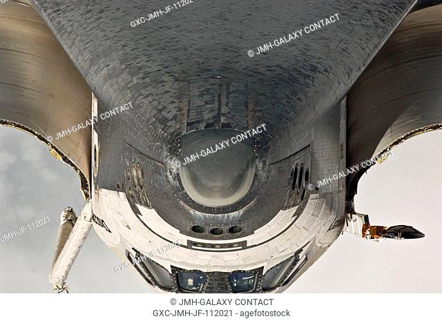 This view of the nose, the forward underside and crew cabin of the space shuttle Discovery was provided by an Expedition 26 crew member during a survey of the...