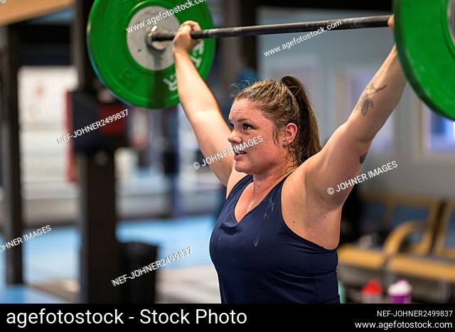 Woman weightlifting in gym