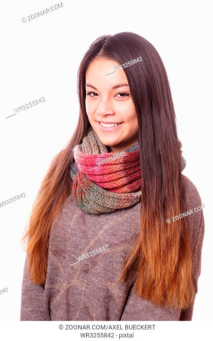 smiling young asian woman wearing wool sweater and scarf