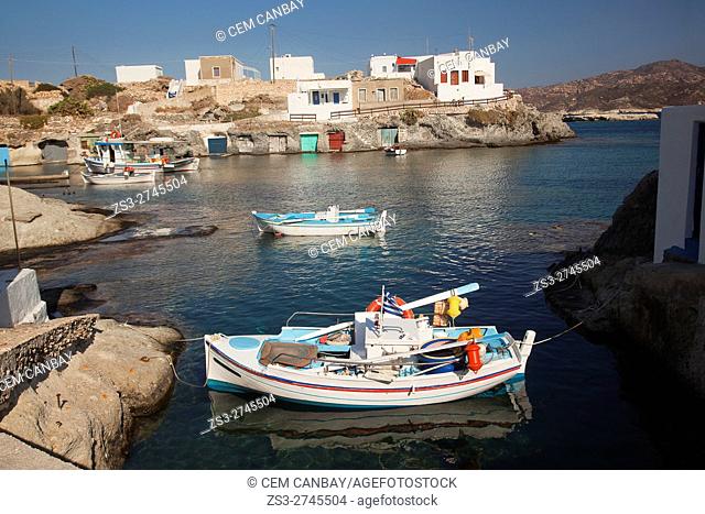 Traditional fishing boats and whitewashed houses in Goupa village, Kimolos, Cyclades Islands, Greek Islands, Greece, Europe