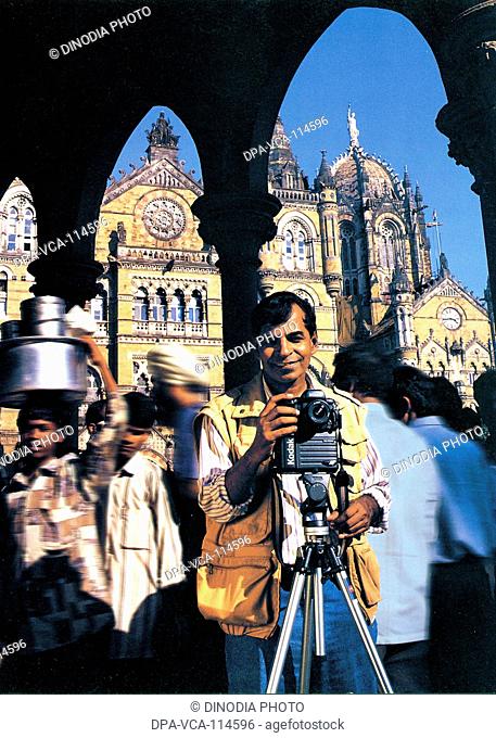 South Asian Indian photographer Pradeep chandra outside VT station MR