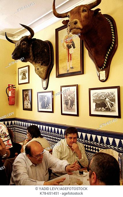 People sitting at Meson Serranito tapas bar, Seville, Spain