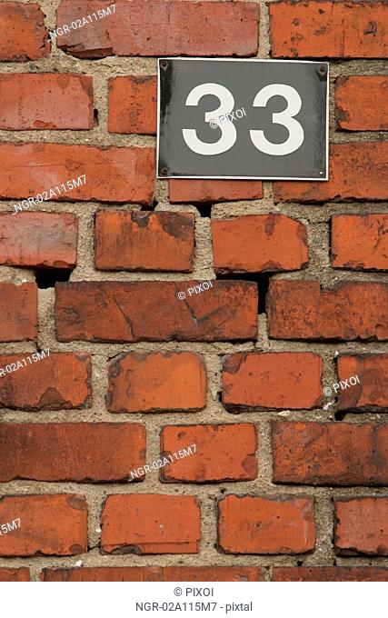 sign in brick wall