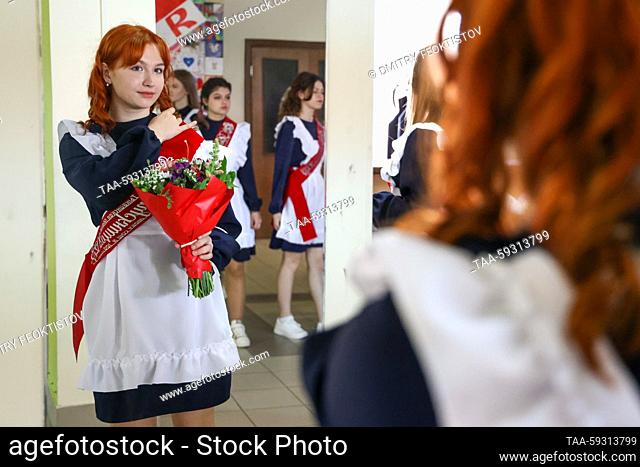 RUSSIA, SOCHI - MAY 23, 2023: A girl prepares for a traditional Last Bell ceremony to celebrate the end of young people's final year at Adler's secondary school...