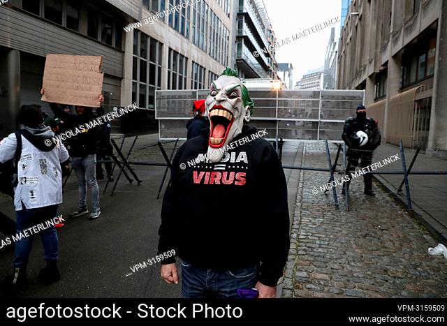 Illustration picture shows a protester wearing a mask of comic book and movie character 'The Joker' during a protest against the health pass (Marche pour la...