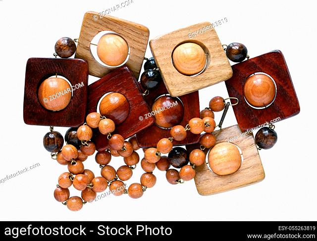 Homemade female beads are made of oak nut wooden simple cubes and balls. Isolated on white macro shot